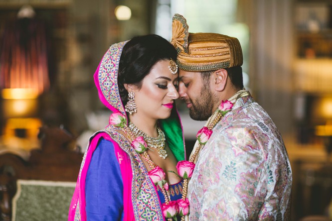 Premium Photo | A bride and groom pose for a photo in a temple.