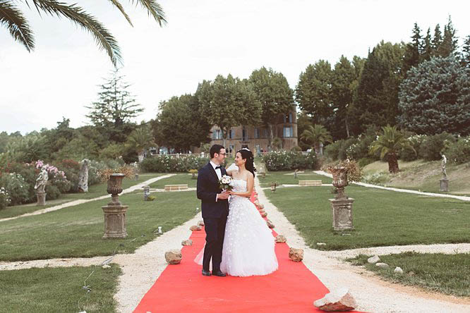 chateau de robernier wedding bride and groom on red carpet