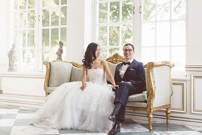 bride and groom sat down on louis xv chair at chateau de robernier