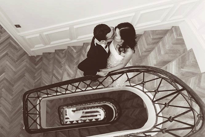 chateau de robernier staircase photo of couple from above after their wedding