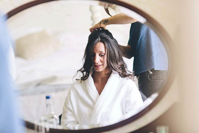 bride getting ready before her wedding in cotswolds