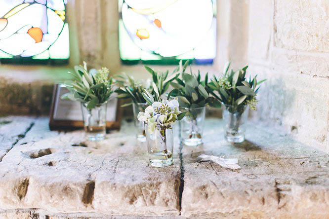 miniature glasses with wedding flowers 