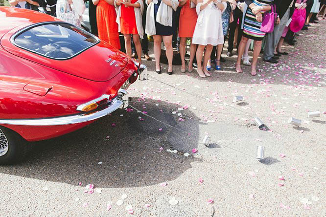 wedding car with tin cans at the back