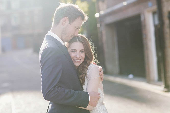 married couple hug in mayfair street