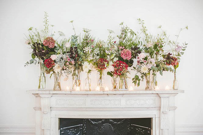 vintage wedding florals above mantelpiece at one horse guards