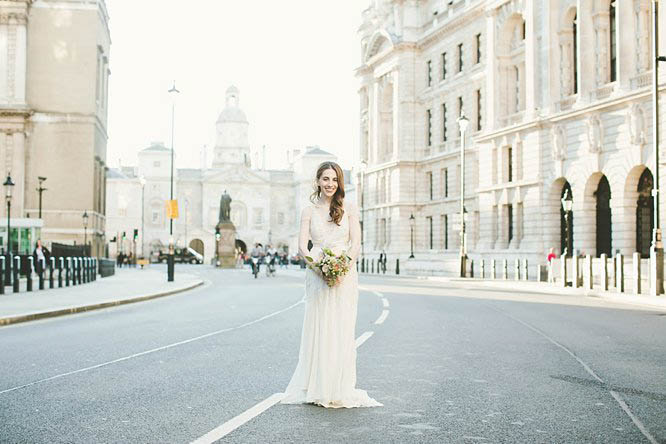 bride wearing temperley full length wedding dress