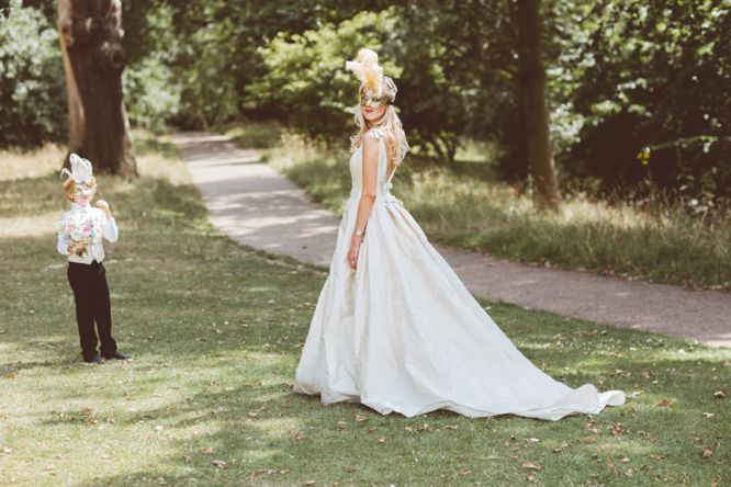 bride wearing mask wedding dress