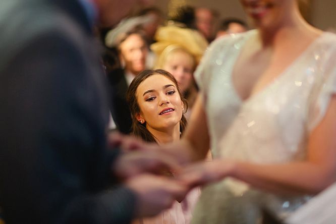 bridesmaid looks on during wedding at royal society arts