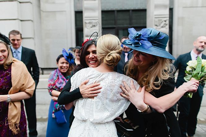 emotional guests hug bride at rsa house wedding