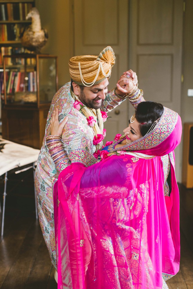 Portrait of an Indian wedding couple posing for album Stock Photo - Alamy