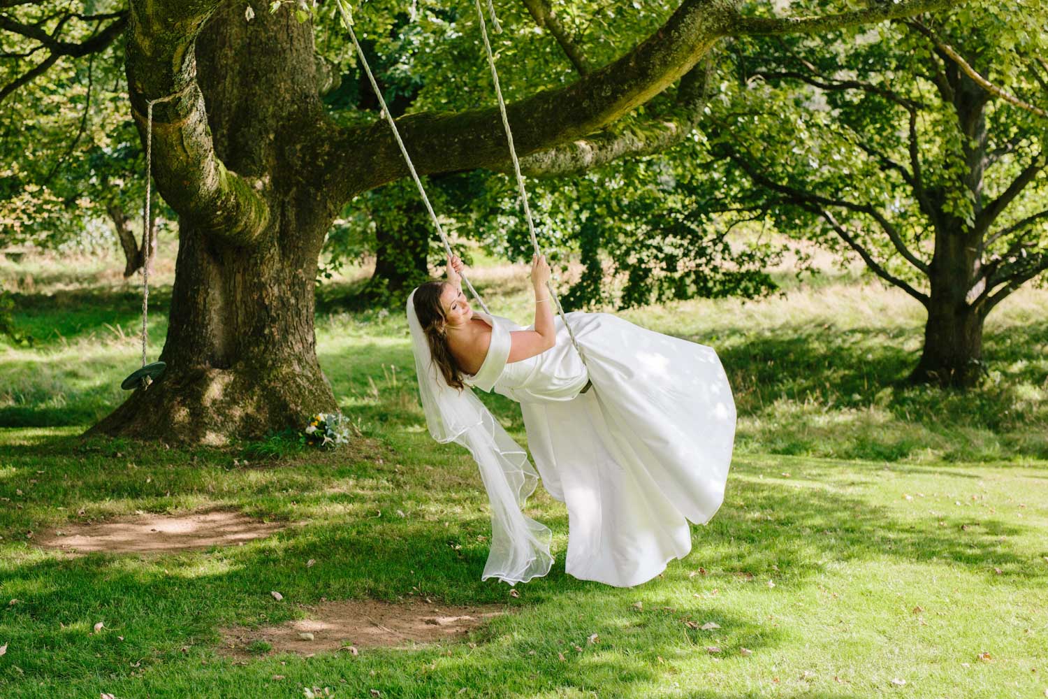 bride swinging on a wedding swing