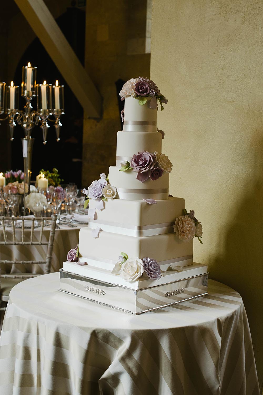 Peggy Porschen 4 tier Wedding cake decorated with pastel coloured flowers 